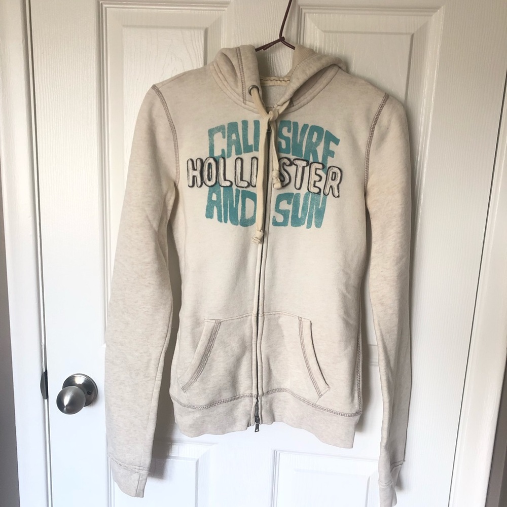 Hollister Cream Zip-Up Hoodie with Teal Graphic